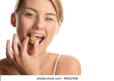 Woman with walnut winking