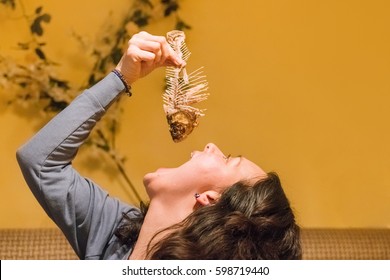 Girl Swallowing Fish