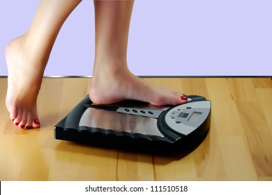 A woman wants to weigh and stands on the scales