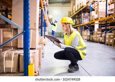 Woman Warehouse Worker With Clipboard.