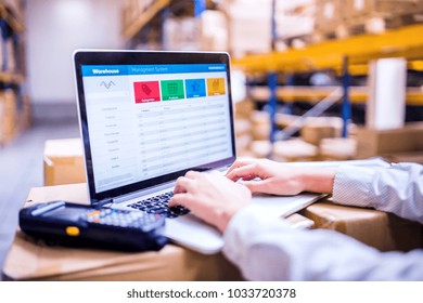 Woman Warehouse Worker Or Supervisor With Laptop