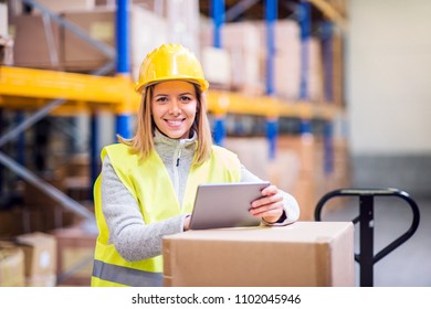 Woman Warehouse Worker With Tablet.