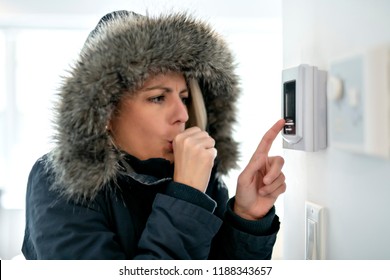 Woman With Warm Clothing Feeling The Cold Inside House