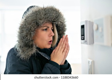 Woman With Warm Clothing Feeling The Cold Inside House