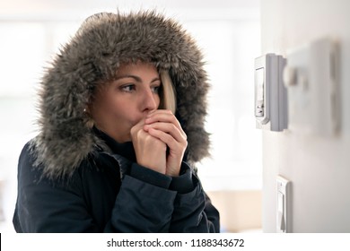 Woman With Warm Clothing Feeling The Cold Inside House