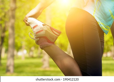 Woman Warming Up Before Running