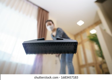 Woman Washes The Floor With A Steam Mop.