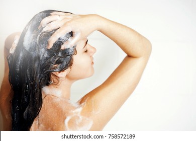 Woman Washes Her Hair In Shower Stands Back To Camera, Steam Coming, Happy Girl Takes A Shower, A Lot Of Foam On  Hair