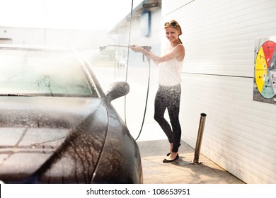 Woman Washing The Car