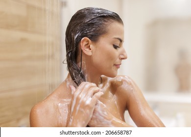 Woman Washing Hair Under Shower 