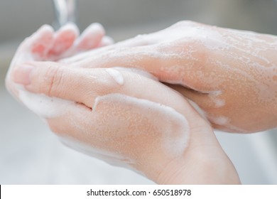 Woman Washing Hands With Soap