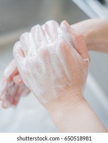 Woman Washing Hands With Soap