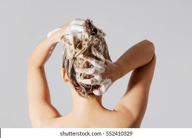 Woman Washing Her Blond Hair