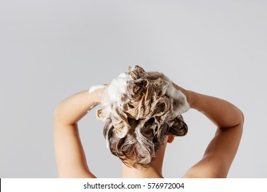 Woman Washing Her Blond Hair