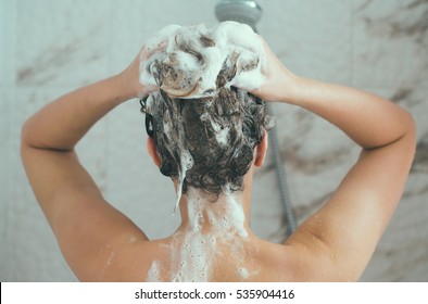 Woman Washing Her Head In The Shower.