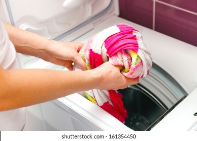 Woman and washing machine