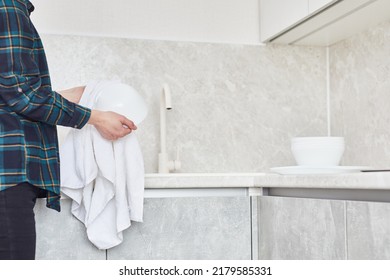 Woman Washing Plate Above Sink In Kitchen.  Female Hand Washing Dishes At Home Kitchen.