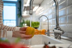 Woman Washing Of Yellow Pepper Under Tap Water. Tasty Raw Sweet Fresh Vegetable Full Of Vitamins, Ingredient Used For Salad Cooking. Organic Vegetarian Food. Natural Nutrition For Good Health, Detox