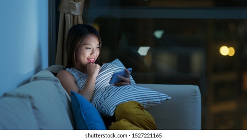 Woman Watch Video Drama On Cellphone At Night