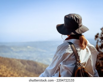 Woman Watching Beautiful Nature Mountain Landscape Sitting On Viewpoint. Popular Tourist Destination. Traveling, Hiking, Freedom And Active Lifestyle Concept. Concept Of An Ideal Resting Place.