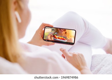 Woman Watching Cooking Video On Mobile Phone