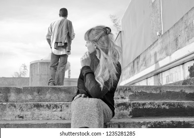 Woman Watching Her Man Leaving.Young Couple Divorced And Brake Up Relationship