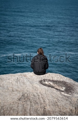 Similar – Image, Stock Photo Enjoy the view. Woman with headband, jacket. Ireland