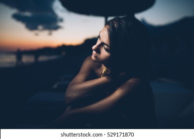 Woman Watching The Ocean,sea Horizon With A Moon On The Sky.Eclipse Of The Moon.Eclipse Of The Sun.Stargazing,watching Stars On The Beach Under The Moonlight.Enjoying Summer Nights.Night Sky.Sunrise