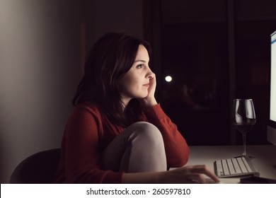 Woman watching online videos on desktop
