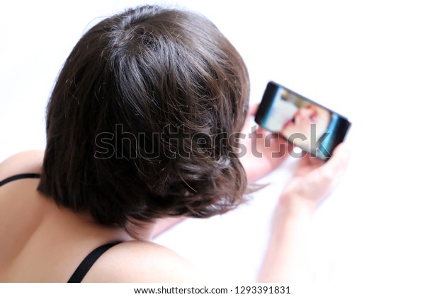 Lying Porn - Woman Watching Porn Video On Smartphone Stock Photo (Edit ...