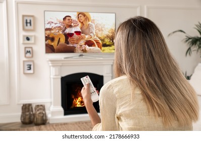 Woman Watching Romantic Movie On TV At Home