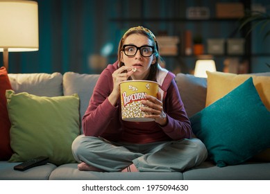 Woman Watching A Suspense Movie And Eating Popcorn