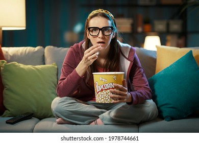 Woman Watching A Suspense Movie And Eating Popcorn