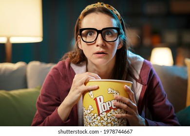 Woman Watching A Suspense Movie And Eating Popcorn