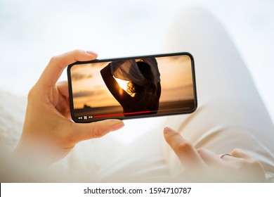 Woman Watching Video On Mobile Phone