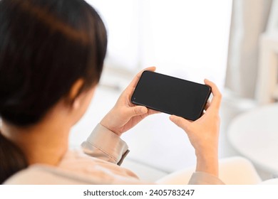 Woman watching video on smartphone