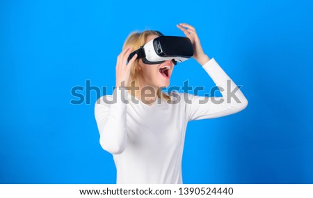 Woman watching virtual reality vision. Woman using virtual reality headset. Funny woman experiencing 3D gadget technology - close up. Digital virtual reality