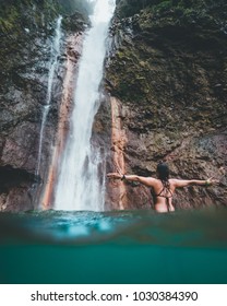 Woman In Waterfall In Costa Rica