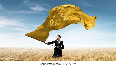 Woman Waving Yellow Flag