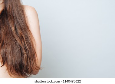  woman with wavy long hair posing in the studio - Shutterstock ID 1140493622