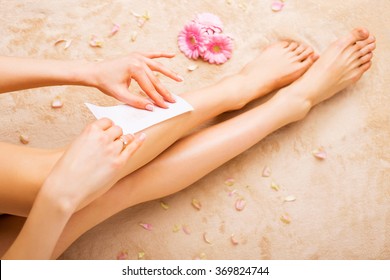 Woman Waxing Legs