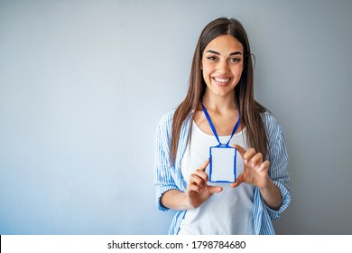 Woman wear blank ID badge mockup, stand isolated. Name tag on neck and chest. Person identity label. Women in shirt uniform with empty id card mock up. Bussinesswoman lanyard design. - Shutterstock ID 1798784680