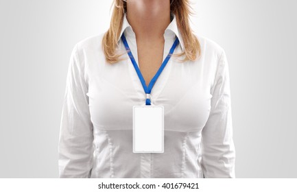 Woman wear blank white vertical badge mockup, stand isolated. Name tag on neck and chest. Person identity label. Women in shirt uniform with empty id card mock up.  Bussinesswoman lanyard design.