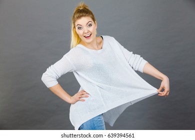 Woman Wearing Too Big Jumper, Not Fitting After Weight Loss. Grey Background