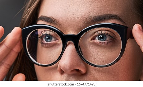 Woman Wearing Black Frame Glasses For Vision Close Up