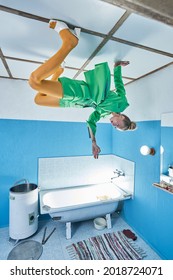 Woman wearing bright clothes laying at the ceiling and looking at her hand