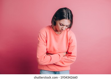 Woman Wearing Casual Sweater On Background Suffering Stomach Ache With Painful Grimace, Feeling Sudden Period Cramps, Gynecology Concept