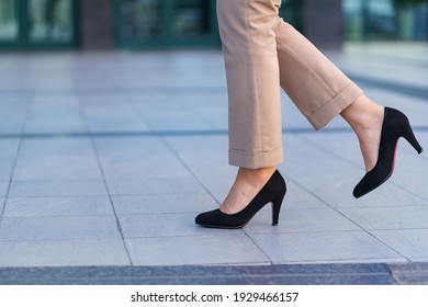 Woman Wearing Classic Black High Heel Toe Shoes. Model Posing On The Street. Elegant Outfit. Close Up.