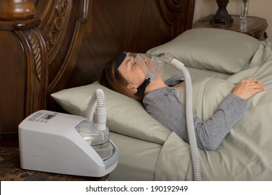 Woman Wearing CPAP Machine For Sleep Apnea