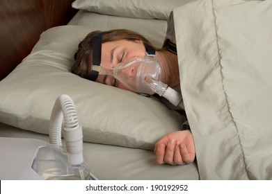 Woman Wearing CPAP Machine For Sleep Apnea